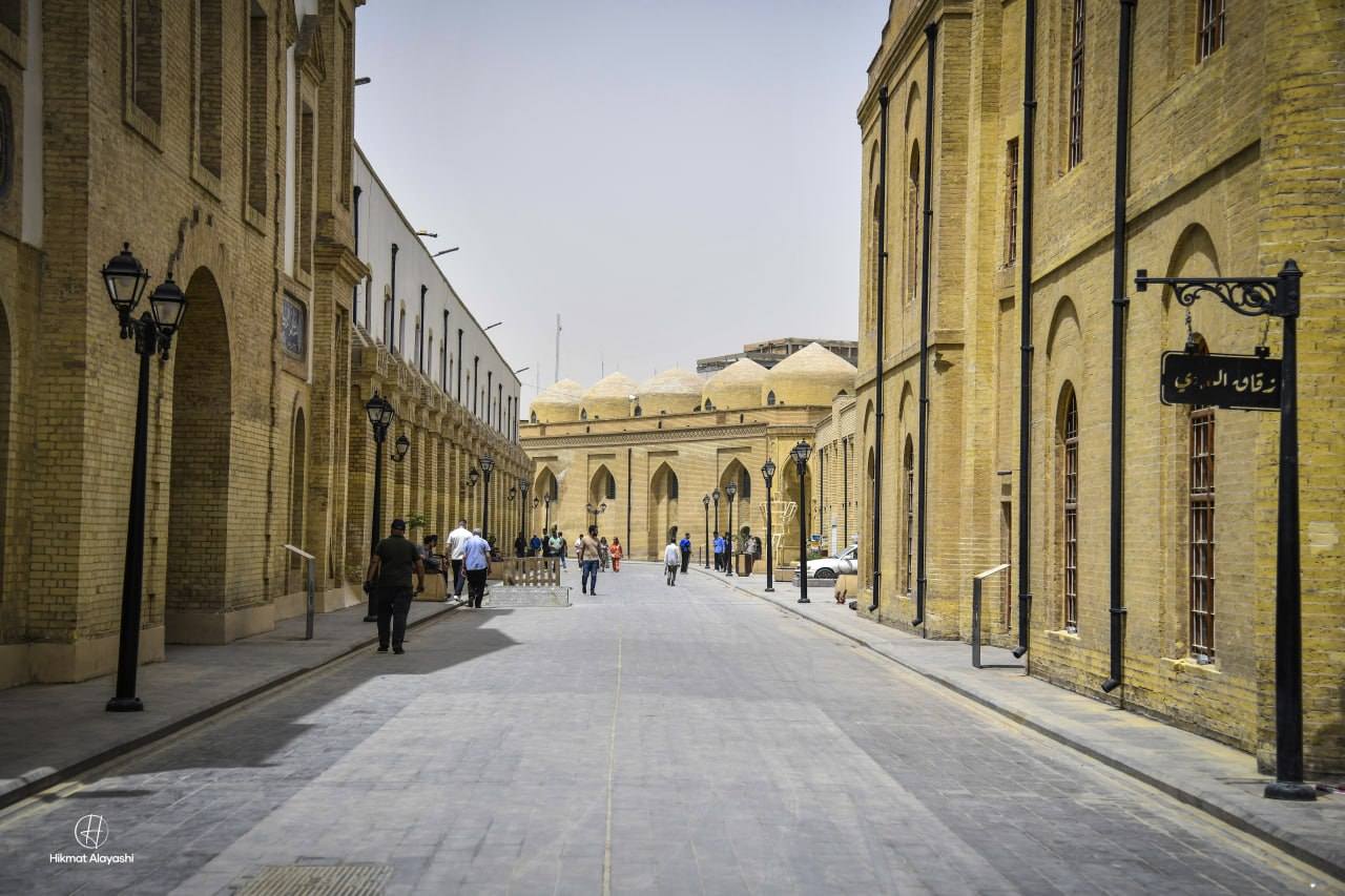 historic street in old Baghdad with traditional brick buildings
