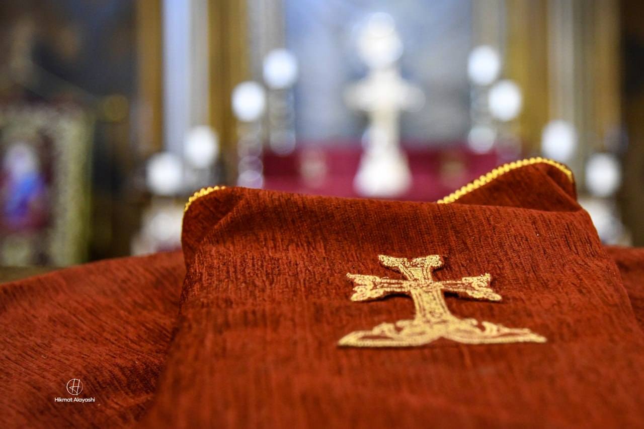 red church cloth embroidered with a cross in Baghdad