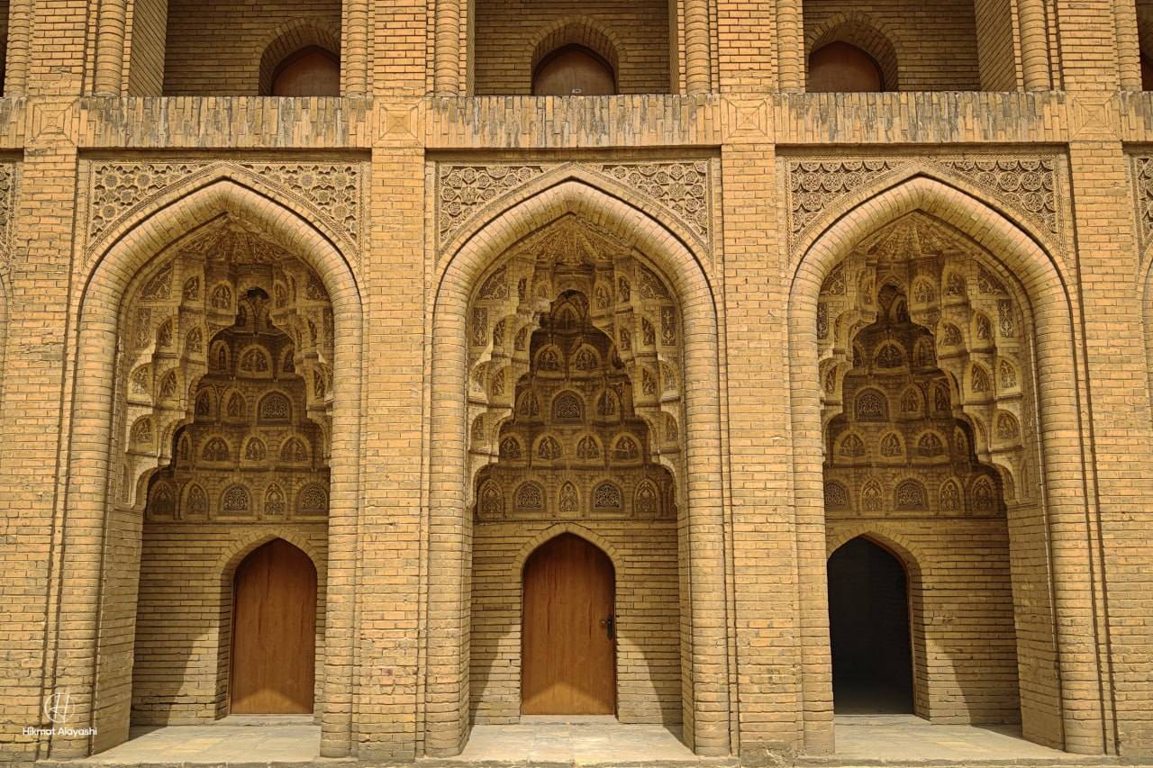 ornate brick arches of an old school building in Baghdad