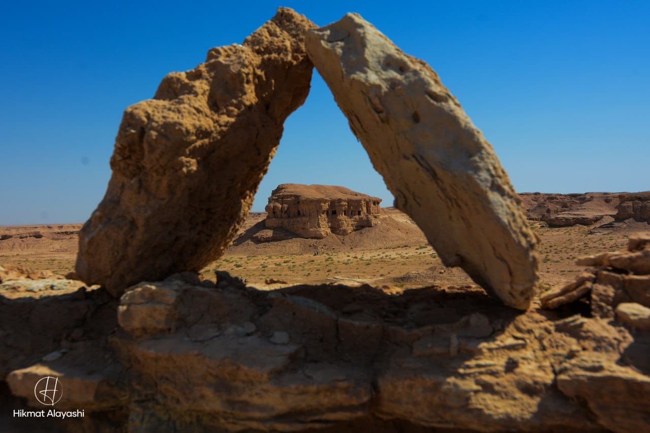 rock cave arch framing ancient desert structure in Iraq