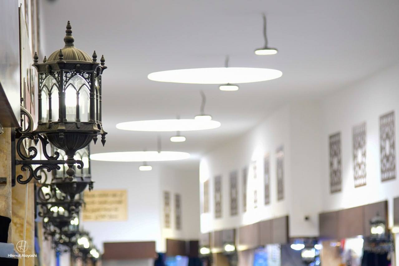 lanterns and ceiling lights inside an old market in Iraq