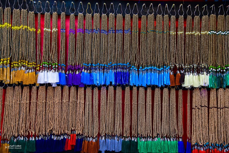 colorful prayer beads hanging in an old market in Iraq
